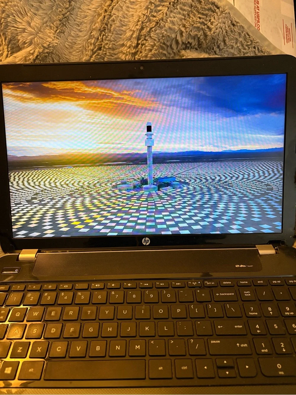 HP Black Laptop with Glossy Black Bezel and Matte Black Keyboard